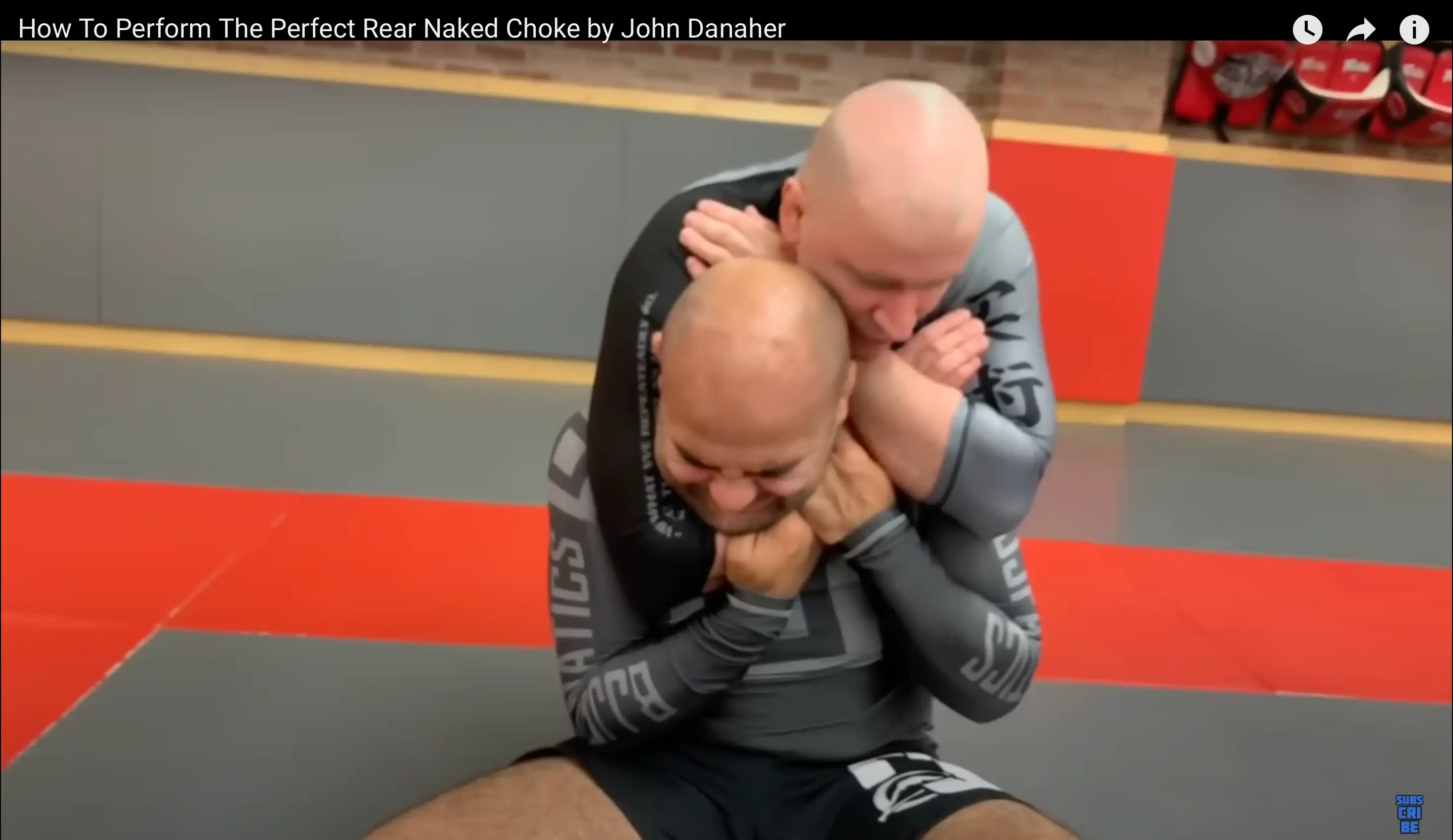 Bernardo Faria pulling on John Danaher’s arm